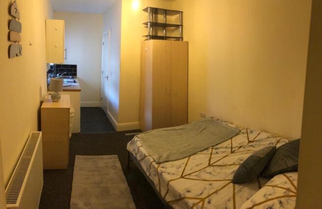 Well-presented furnished bedroom with a cozy do...