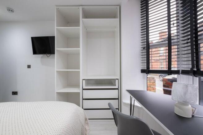 This stylish double bedroom features sleek stor...