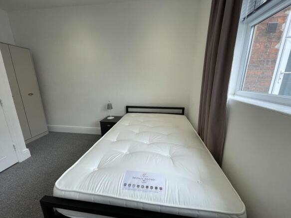 A bright and clean double bedroom with ample na...