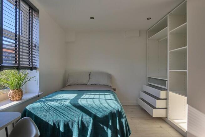 Bright and inviting double bedroom featuring am...