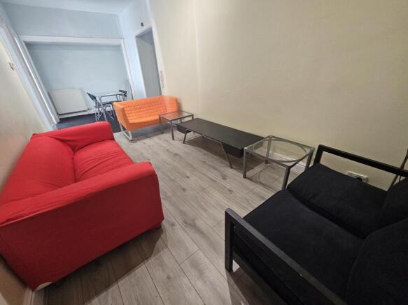 A modern and cozy living room featuring a vibra...