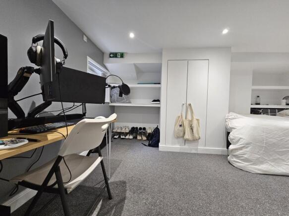 A well-maintained bedroom featuring a comfortab...