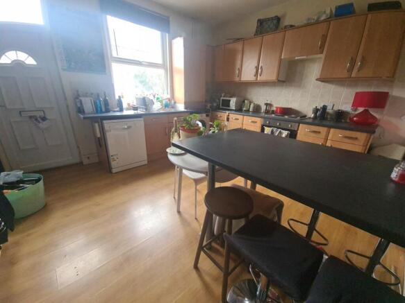 A bright and spacious living room featuring a l...