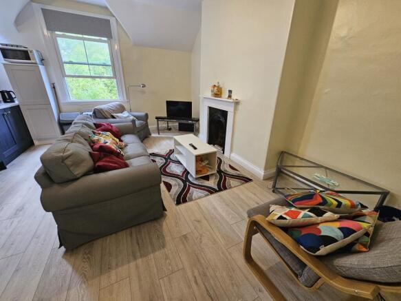 A cozy and inviting living room with comfortabl...