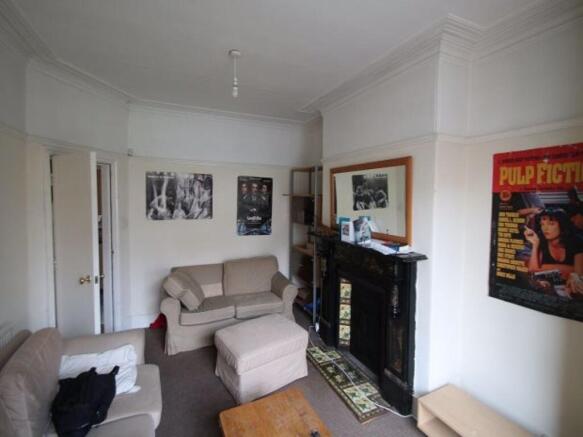 A spacious and well-maintained living room feat...