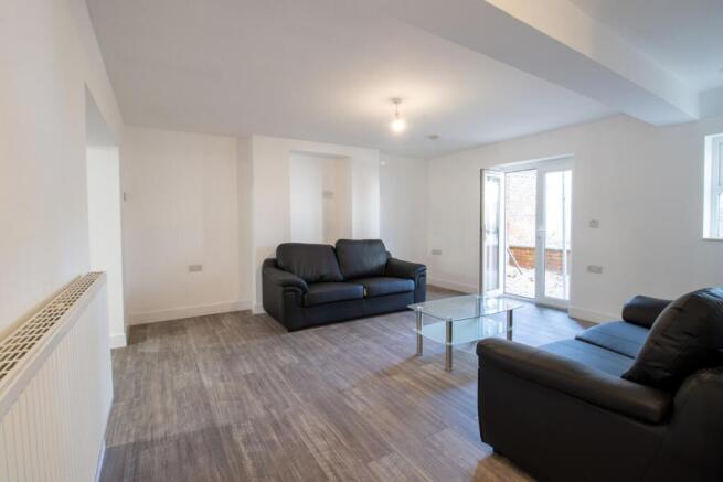 Bright, modern living room with comfortable sof...