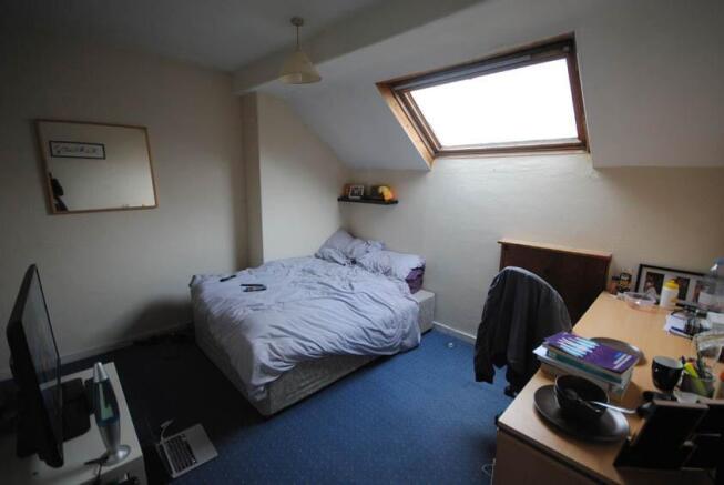 Bright double bedroom in a converted loft with ...