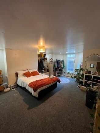 Spacious, well-styled bedroom with a double bed...