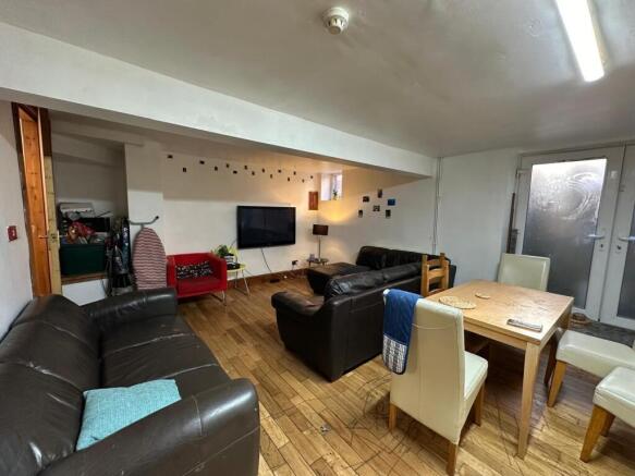 A spacious, well-lit and inviting living room f...