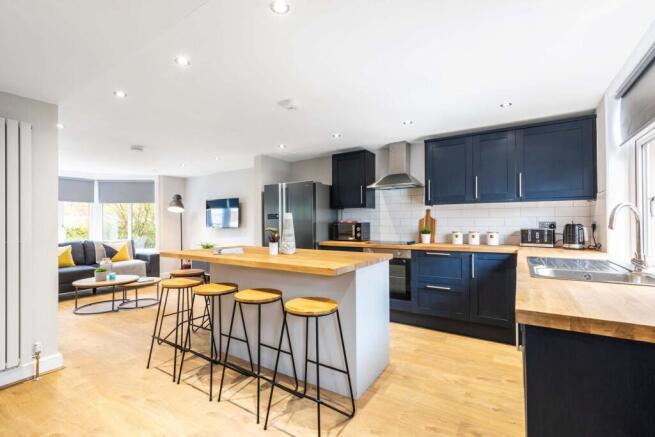 Bright open-plan living space with a modern fit...