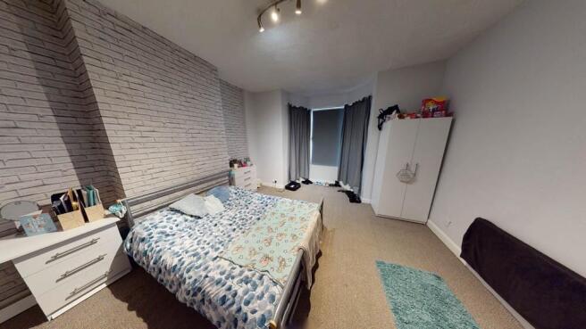 Bright, modern double bedroom with contemporary...