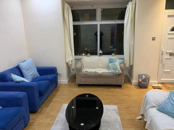 Bright, modern living room with comfortable sea...