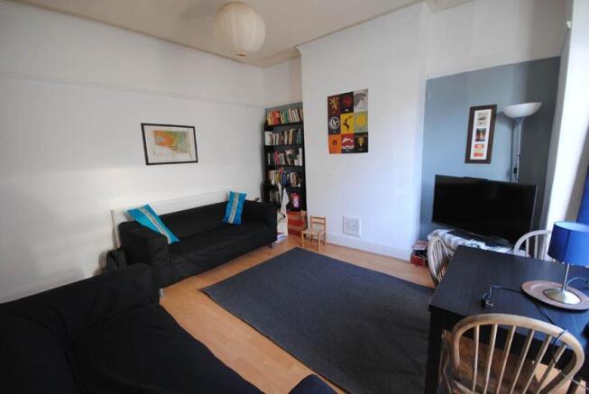 Bright, modern living room with comfortable sof...