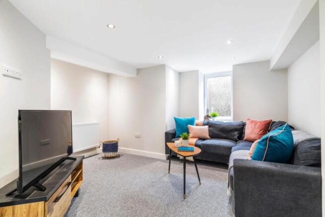 Bright, modern living room with neutral décor, ...