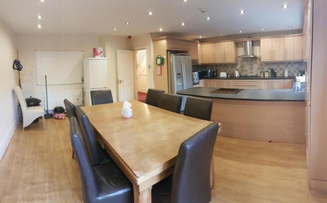 Bright open-plan kitchen and dining area with a...