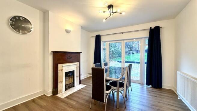 Bright, modern living/dining space with wood fl...