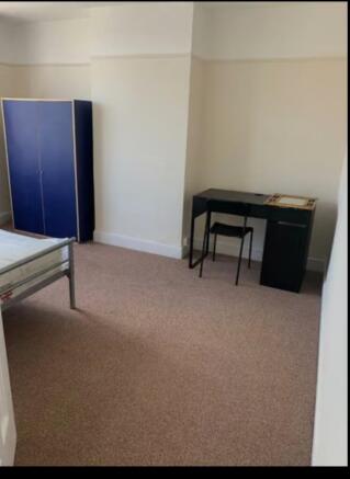 A spacious and inviting double bedroom, perfect...