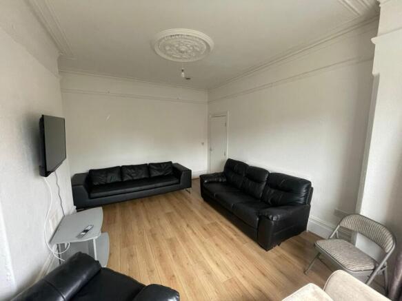 A spacious and inviting large modern living roo...