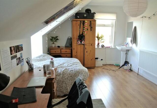 A spacious and well-lit large double bedroom, p...