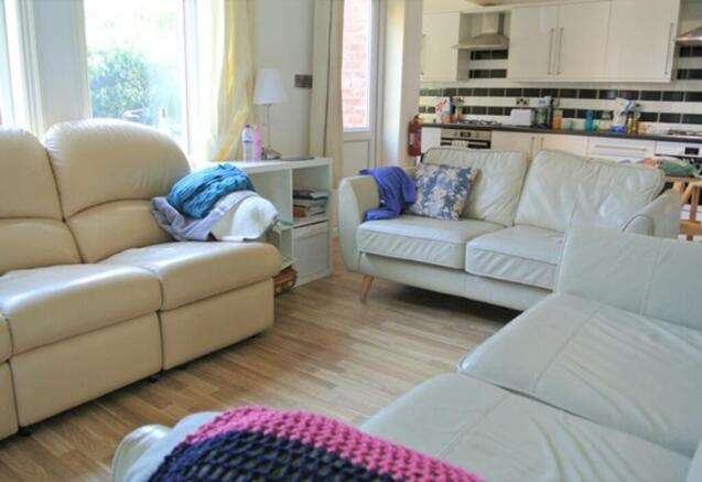 A spacious and inviting modern living room perf...