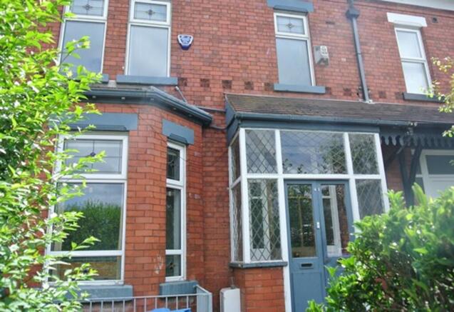 A charming exterior view of the property, featu...