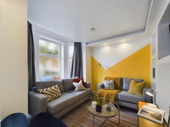 A bright and inviting large modern living room ...