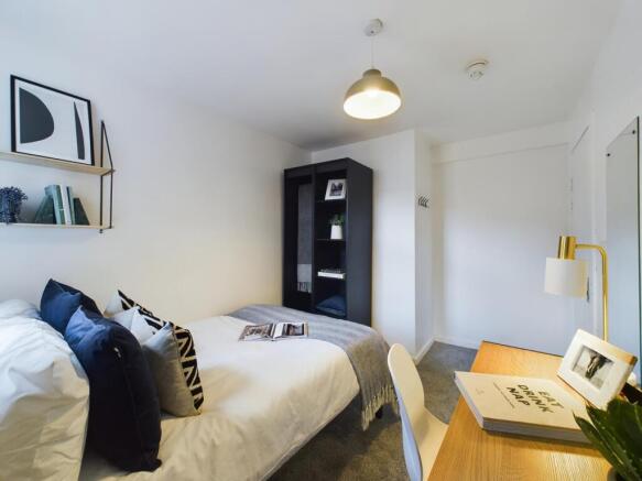 A stylish and inviting double bedroom featuring...