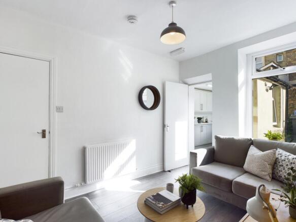 A bright and inviting large modern living room,...