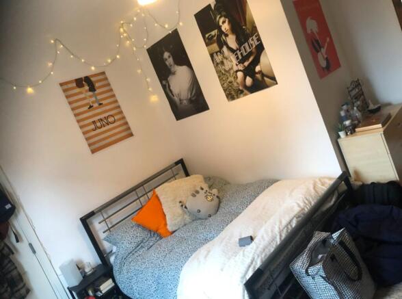 A cozy double bedroom featuring stylish decor w...