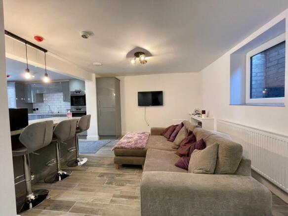 Spacious and inviting living room featuring a c...