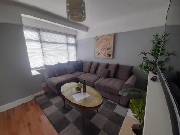 Bright and inviting living room featuring a spa...