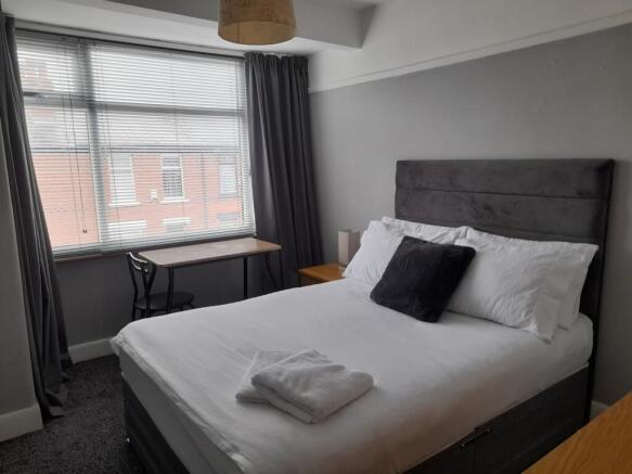 A beautifully presented double bedroom featurin...