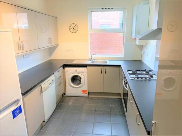 This well-appointed kitchen features modern app...