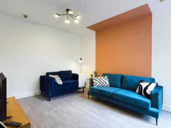 A stylish and spacious modern living room featu...