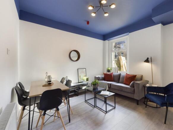 A spacious and stylish modern living room, perf...