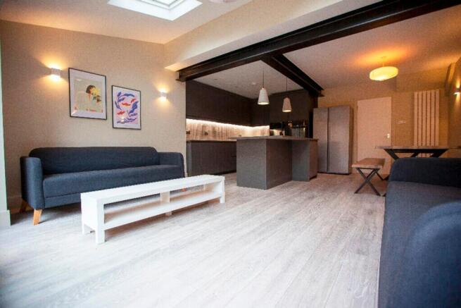 A spacious and inviting large modern living roo...