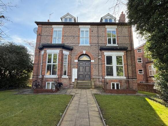 Charming exterior view of a classic brick build...