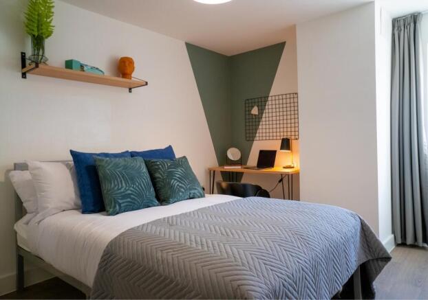 A stylish and inviting double bedroom featuring...