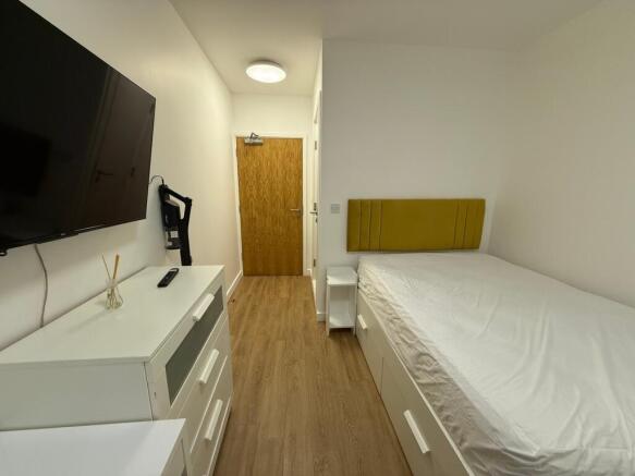 Bright and modern double bedroom featuring a co...