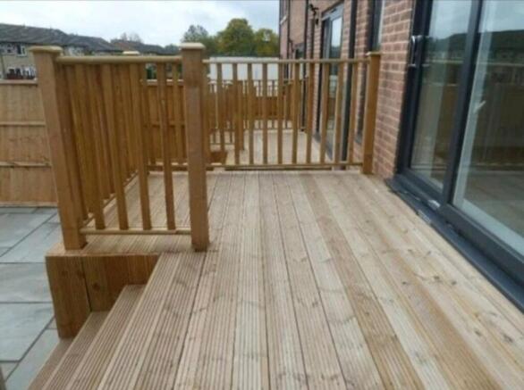 A beautifully designed outdoor deck area that o...