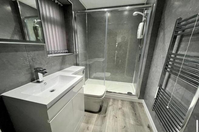 Stylish and modern bathroom suite featuring a s...