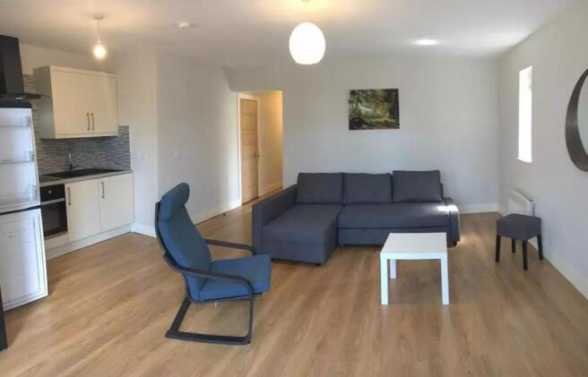 Spacious and inviting living room featuring mod...