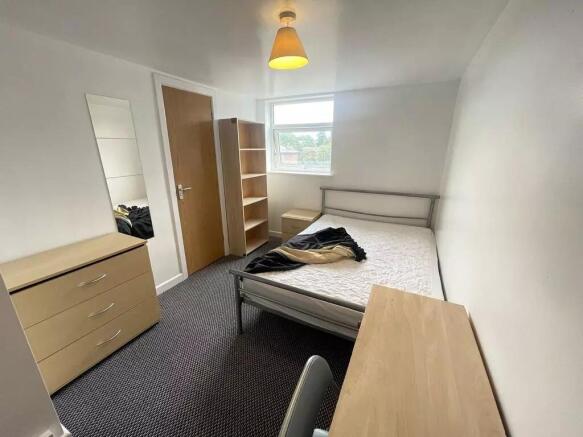 This bright and inviting double bedroom feature...
