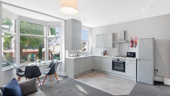 Modern kitchen featuring ample natural light, s...