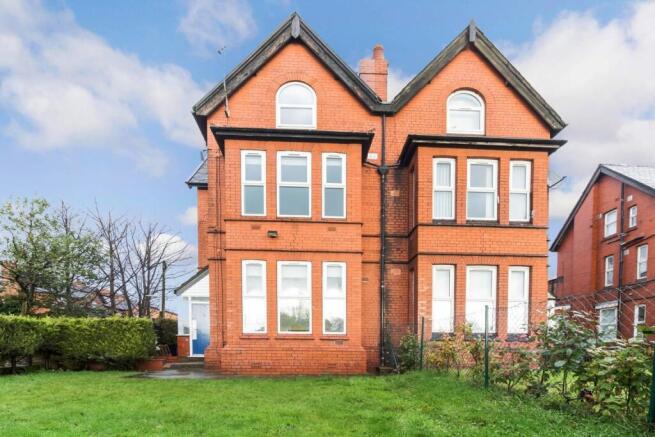 Charming red-brick exterior with large windows,...