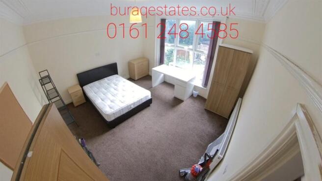 Bright and spacious master bedroom featuring a ...