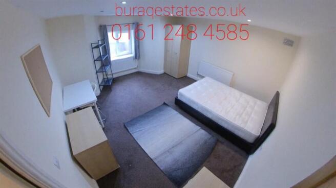 A bright and neatly arranged double bedroom fea...
