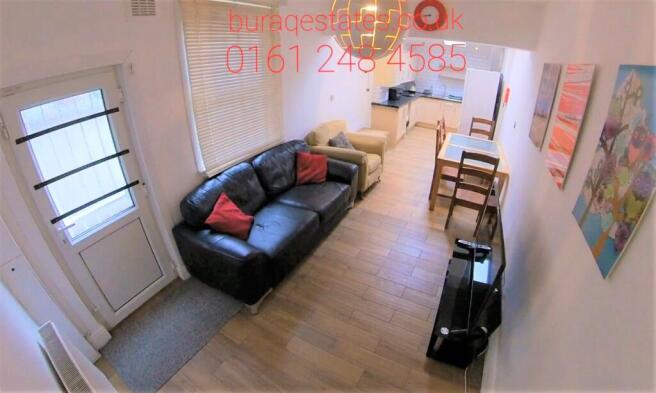 Bright and cozy living room featuring a comfort...