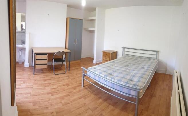 Bright and tidy double bedroom featuring a meta...
