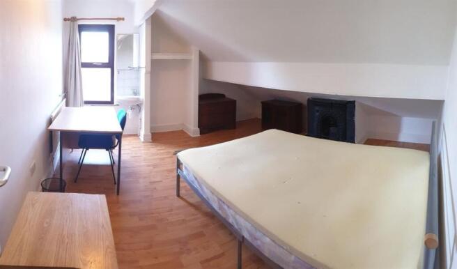 Bright and airy master bedroom featuring a larg...